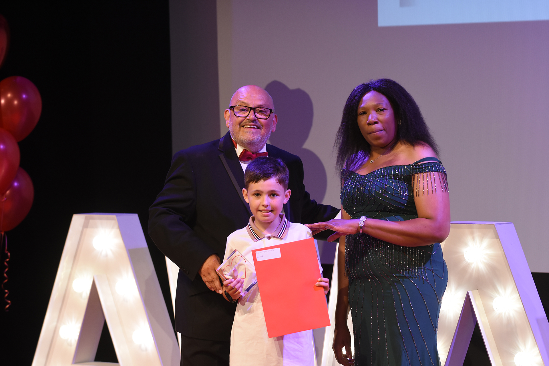 Winner Joe Mackintosh presented by Shamiso Machaya, Chief Executive CREST (Compact for Race Equality South Tyneside)