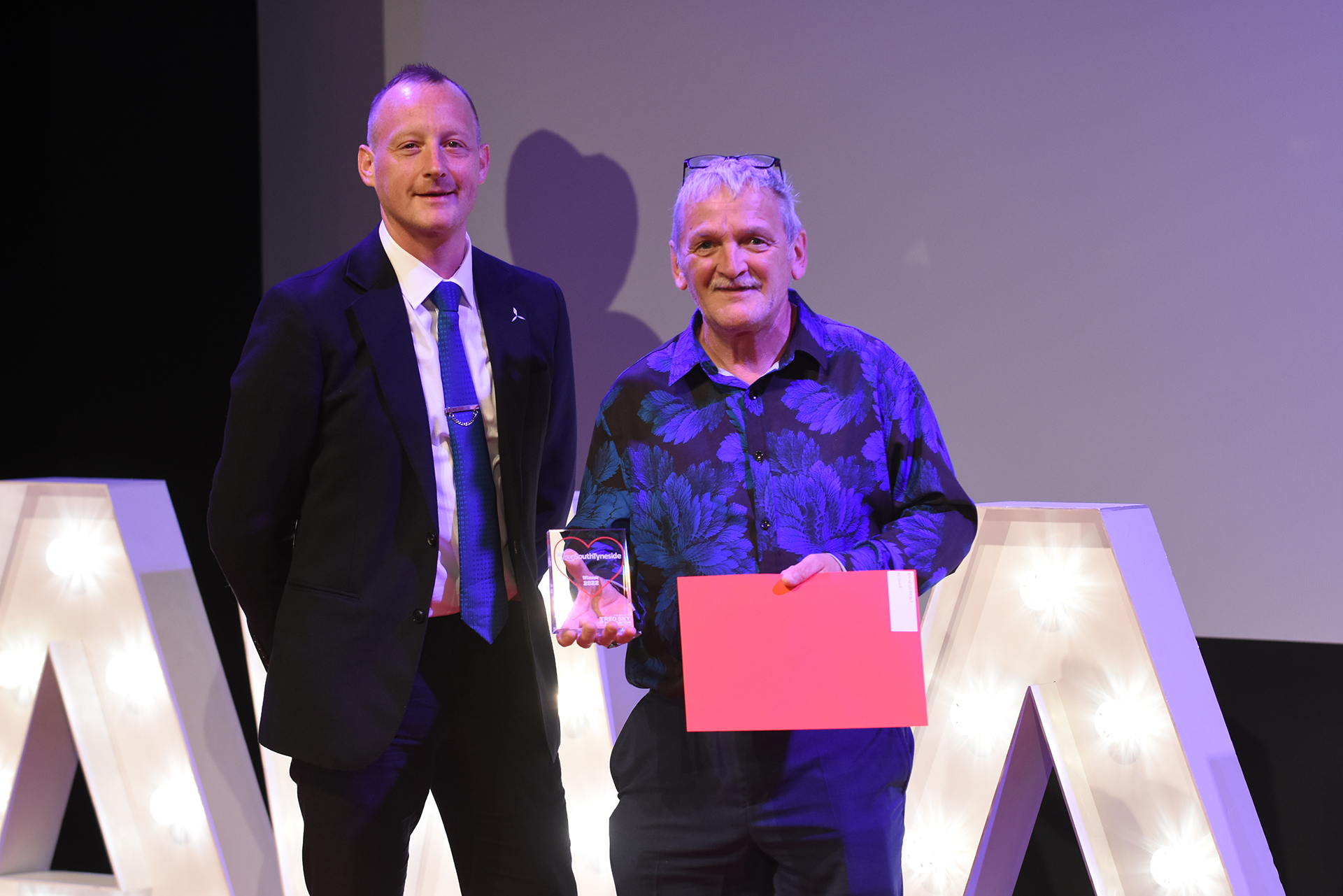 Winner John Stewart presented by Tim Nightingale, Equinor North East stakeholder manager