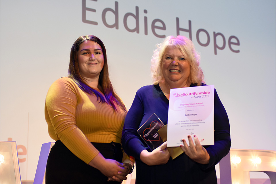 Winner Eddie Hope, presented with their award